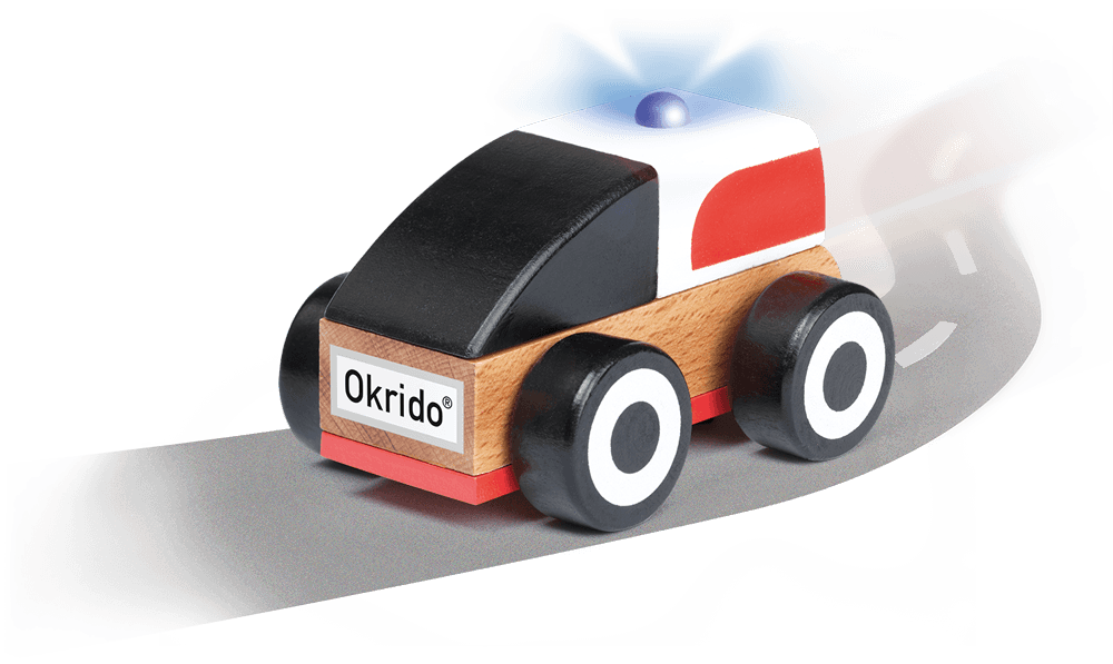 Kleines Holzspielzeug Auto mit der Aufschrift "Okrido, die schnelle Hilfe im Aktufall". 